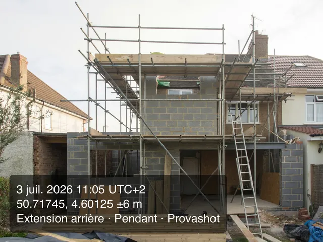 The job during the works, block walls and scaffolding, with the Provashot stamp of 3 July 2026